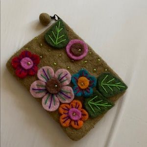 Handcrafted felt coin purse with flower ap…